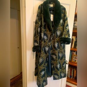 Tuckernuck coat with fur at color and cuffs. New with tags. Size Large